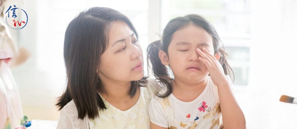 Mother comforting crying child about death and funerals.